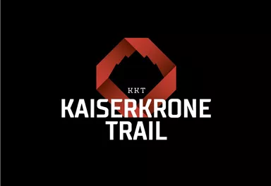 Ein modernes Logo für den Kaiserkrone Trail. Es zeigt einen stilisierten Berg in Rot und schwarze Schriftzug.