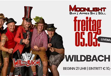 Eine Gruppe von fünf Männern in festlicher Kleidung posiert für die Kamera. Es gibt eine Veranstaltung mit Live-Musik im Moonlight Bar in Söll am Freitag, den 20. Februar.