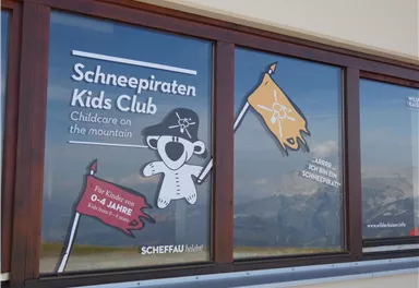 A window displaying the "Snow Pirate Kids Club". It offers child care in the mountains for children aged 0 to 14 years.