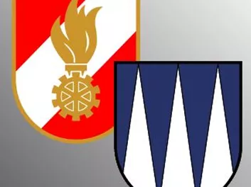 Two heraldic coats of arms on a gray background. On the left, a coat of arms with a flame and gear, on the right, a coat of arms with blue peaks.