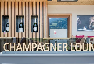 Greil Champagnerlounge Schriftzug