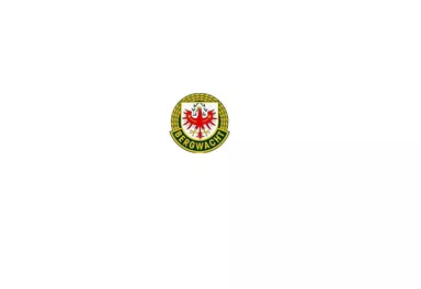 Ein Wappen mit einem roten Adler auf weißem Hintergrund. Das Emblem ist von einem grünen Rand umgeben.
