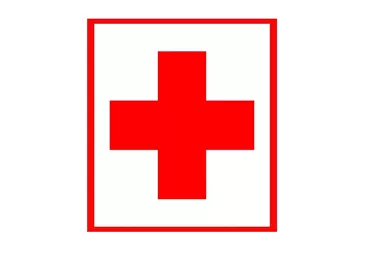 A red cross on a white background. It symbolizes medical assistance and first aid services.