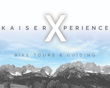 Ein Bild mit dem Titel "KaiserXperience". Es zeigt die Berge in einer schönen Landschaft, wobei der Fokus auf Fahrradtouren und Guiding liegt.