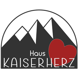 Ein Logo mit dem Text "Haus KAISERHERZ". Es zeigt stilisierte Berge und ein rotes Herz.