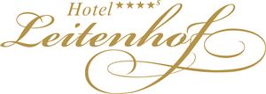 An elegant logo of the Hotel Leitenhof with four stars. The design is in gold and conveys a sense of luxury and hospitality.