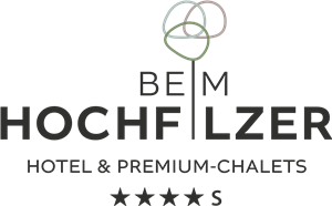 A modern logo for the hotel and the premium chalets "Hochfilzer". It features elegant lettering and a creative graphic element.
