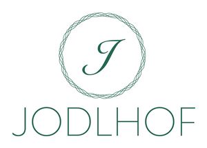 A simple, elegant logo with the lettering "Jodlhof". The colors are in a soft green hue.