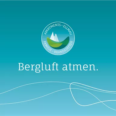 A calm background in soft shades of blue with the inscription "Breathe Mountain Air". The logo of "Apartments Ellmau" complements the design.