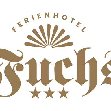 An elegant logo of the Fuchs holiday hotel. It features the hotel name in cursive font and three stars.