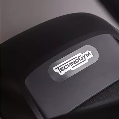A fitness device featuring the Technogym logo. The colors are black and gray, and the construction appears modern.