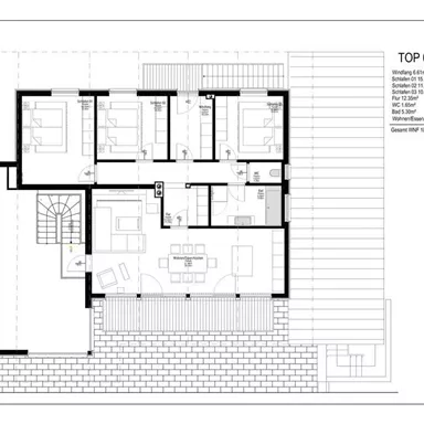 A floor plan of a house with several rooms and an open living area. The drawing shows the arrangement and dimensions of the rooms.