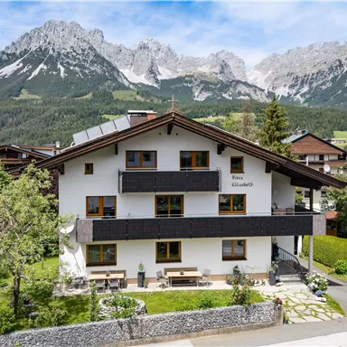 A charming building, our HOUSE ELISABETH, set against an impressive mountain backdrop of the Wild Kaiser in Ellmau.