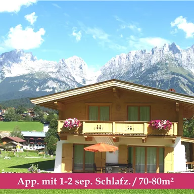 A charming house with a balcony in the mountains.
Surrounded by a picturesque landscape with green meadows and high peaks.