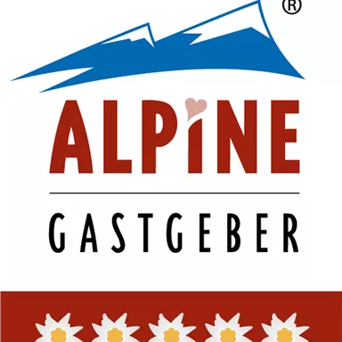 A logo with the inscription "ALPINE GASTGEBER" and stylized mountains. Below, five Alpine flowers are depicted in white.