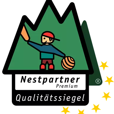 A logo with a stylized mountain, a child with a toy, and five golden stars. The text "Quality Seal" is also present.